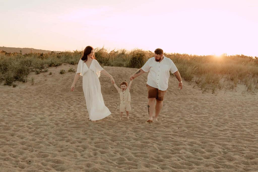 A family posing for their family photos at Sandy Hook Beach in New Jersey. 