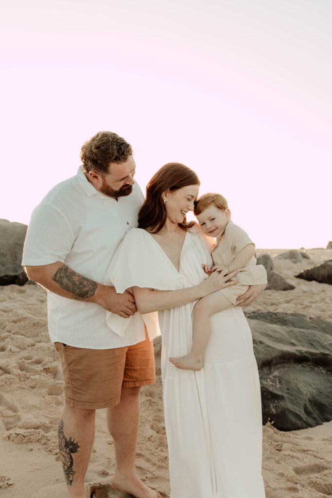 A family posing at Sandy Hook Beach in New Jersey