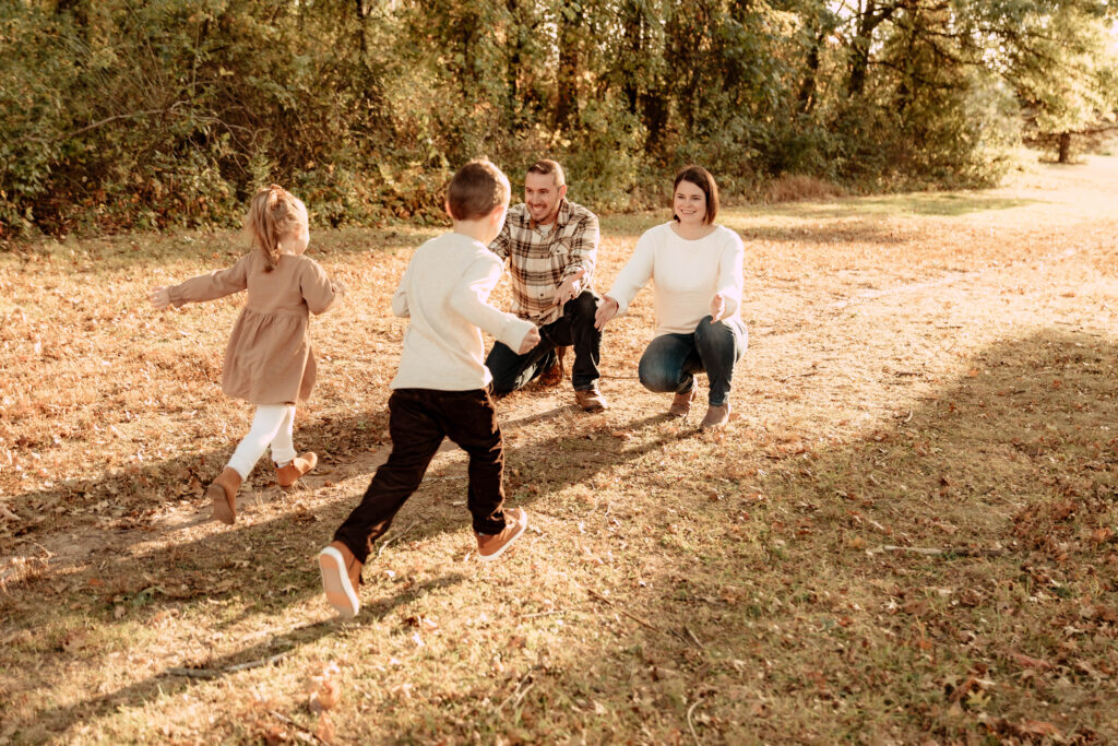 children running during a fall family photo session in New Jersey