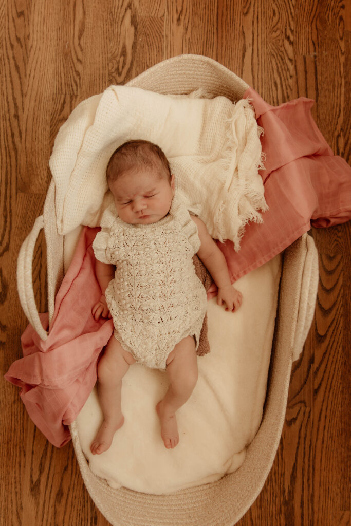 a newborn girl posing for a newborn photo in a home in New Jersey