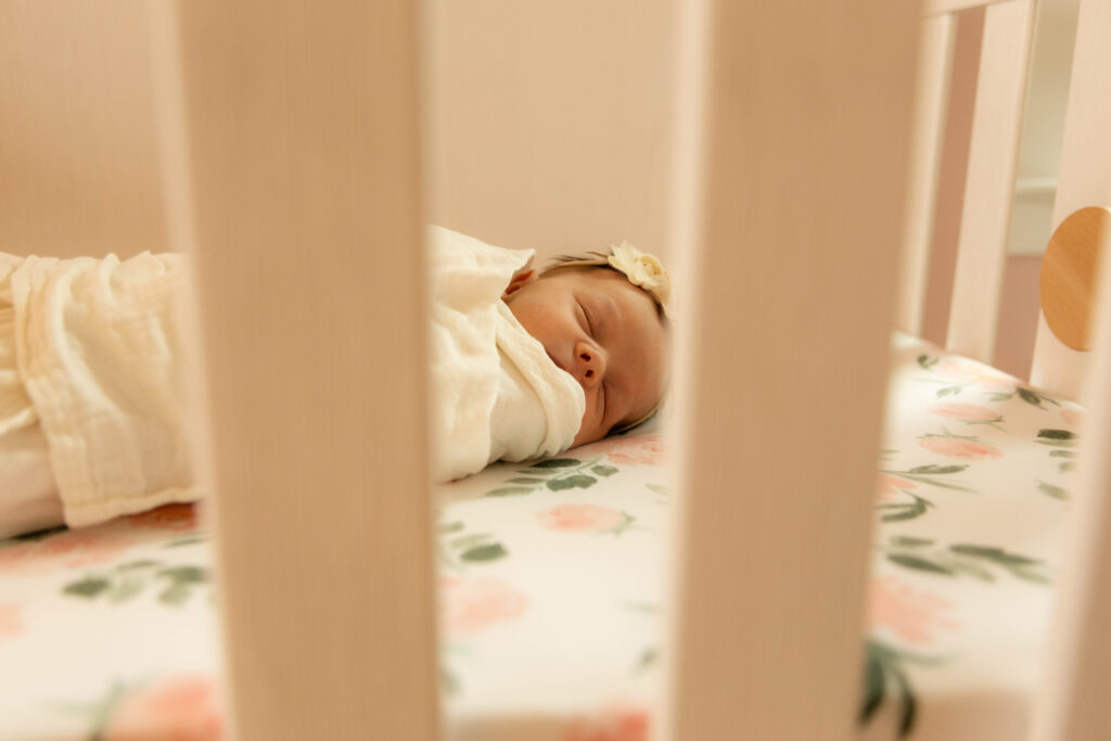 a newborn girl posing for a newborn photo in a home in New Jersey