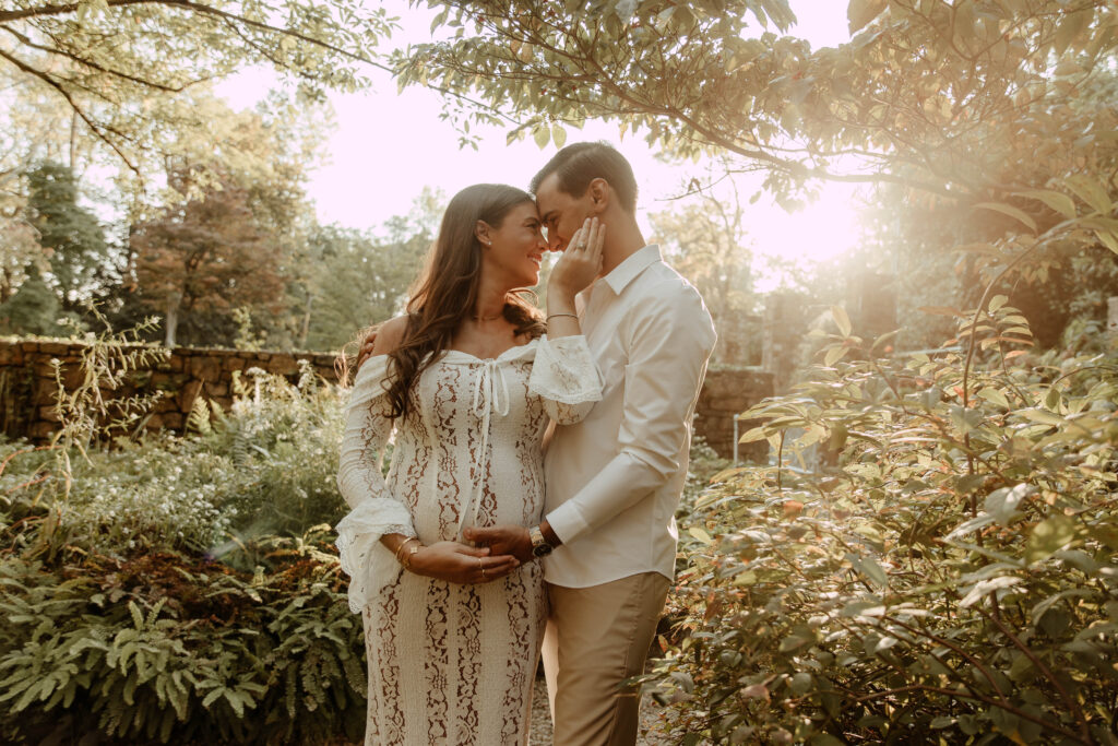 a couple on a maternity session at Cross Estate Gardens in Somerset County New Jersey