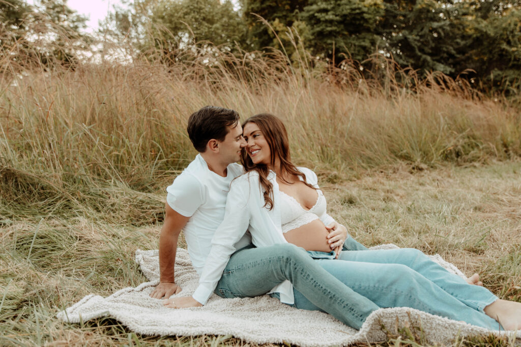 a couple posing for a maternity session at Cross Estate Gardens in New Jersey