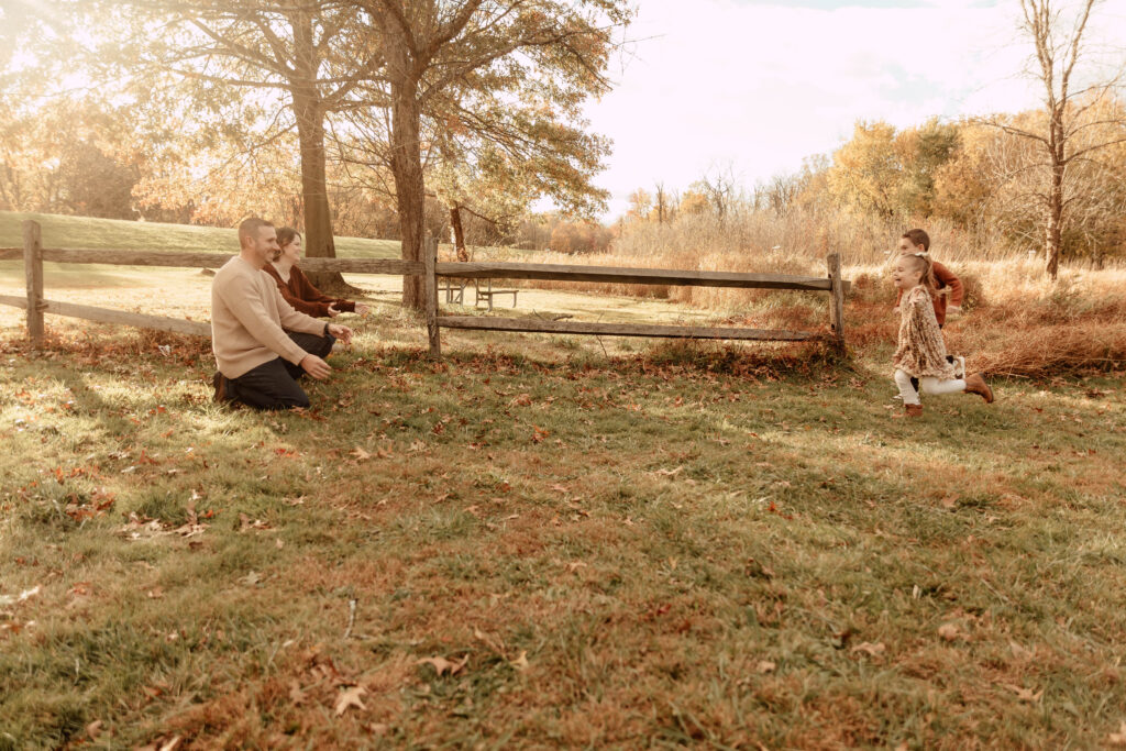 Children running to their parents during a New Jersey family photo session.